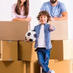 family-moving-home-young-happy-to-new-opening-boxes-61276477